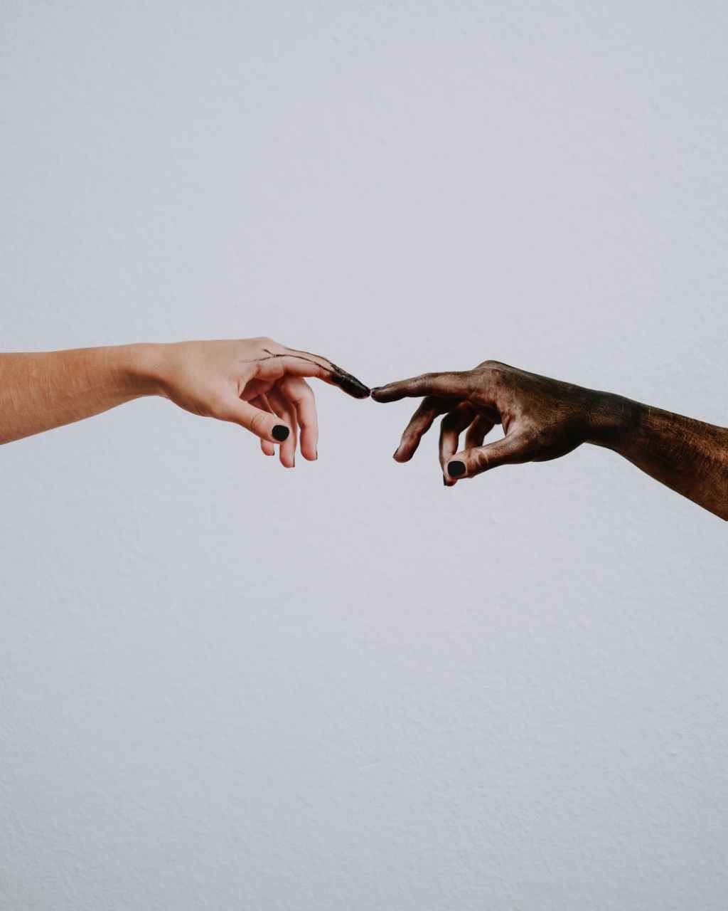 hands of people reaching to each other